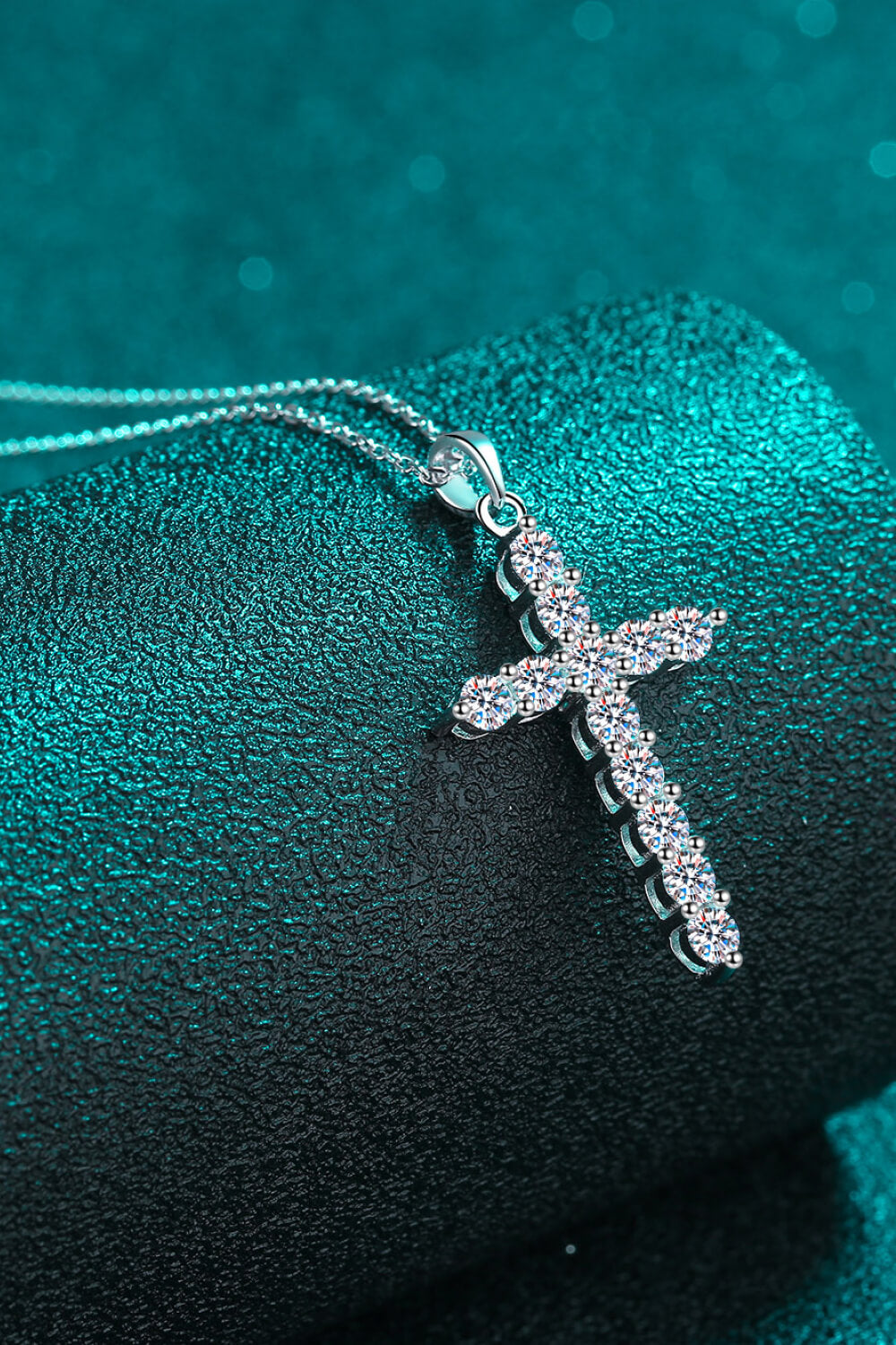 Silver moissanite cross pendant charm with pavé stones, side view