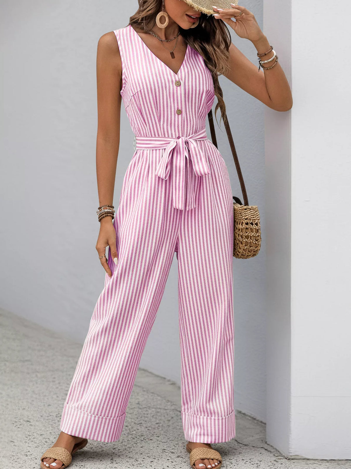 Striped sleeveless V-neck belted jumpsuit in pink and white, button front, wide-leg