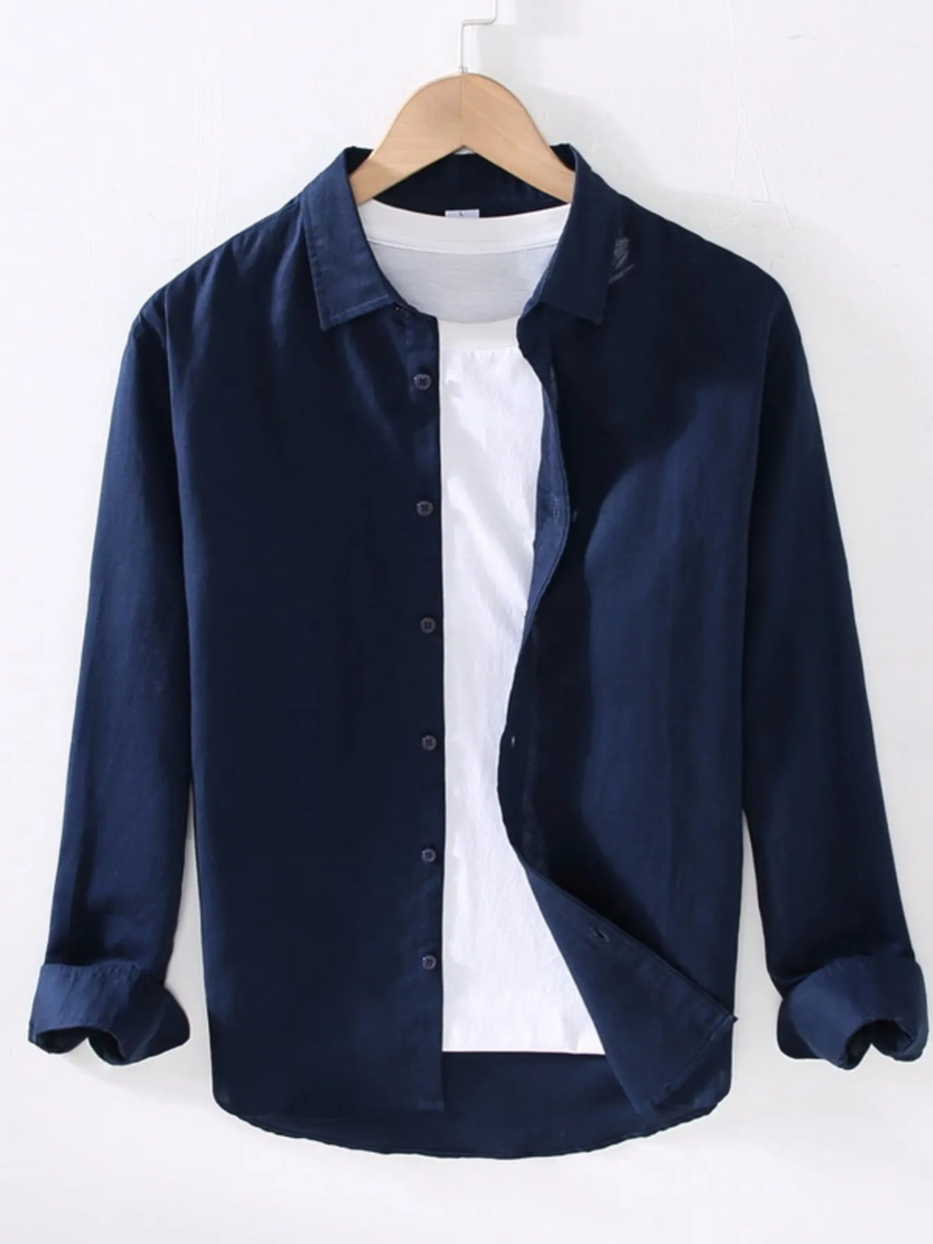 Dark blue button-up short sleeve shirt with pointed collar and front button placket