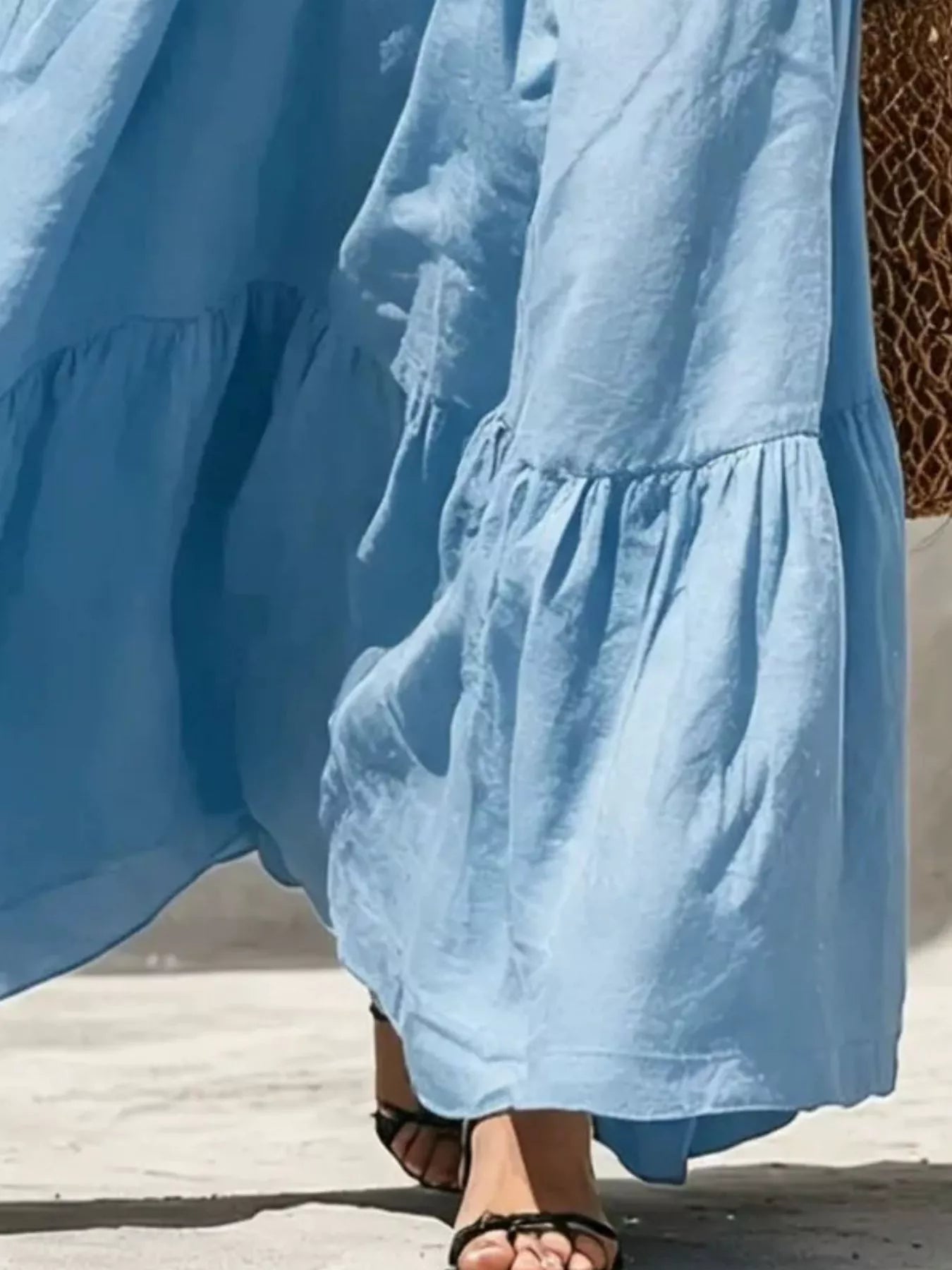 Light blue tiered maxi dress showing ruffled tiers and flowing skirt length