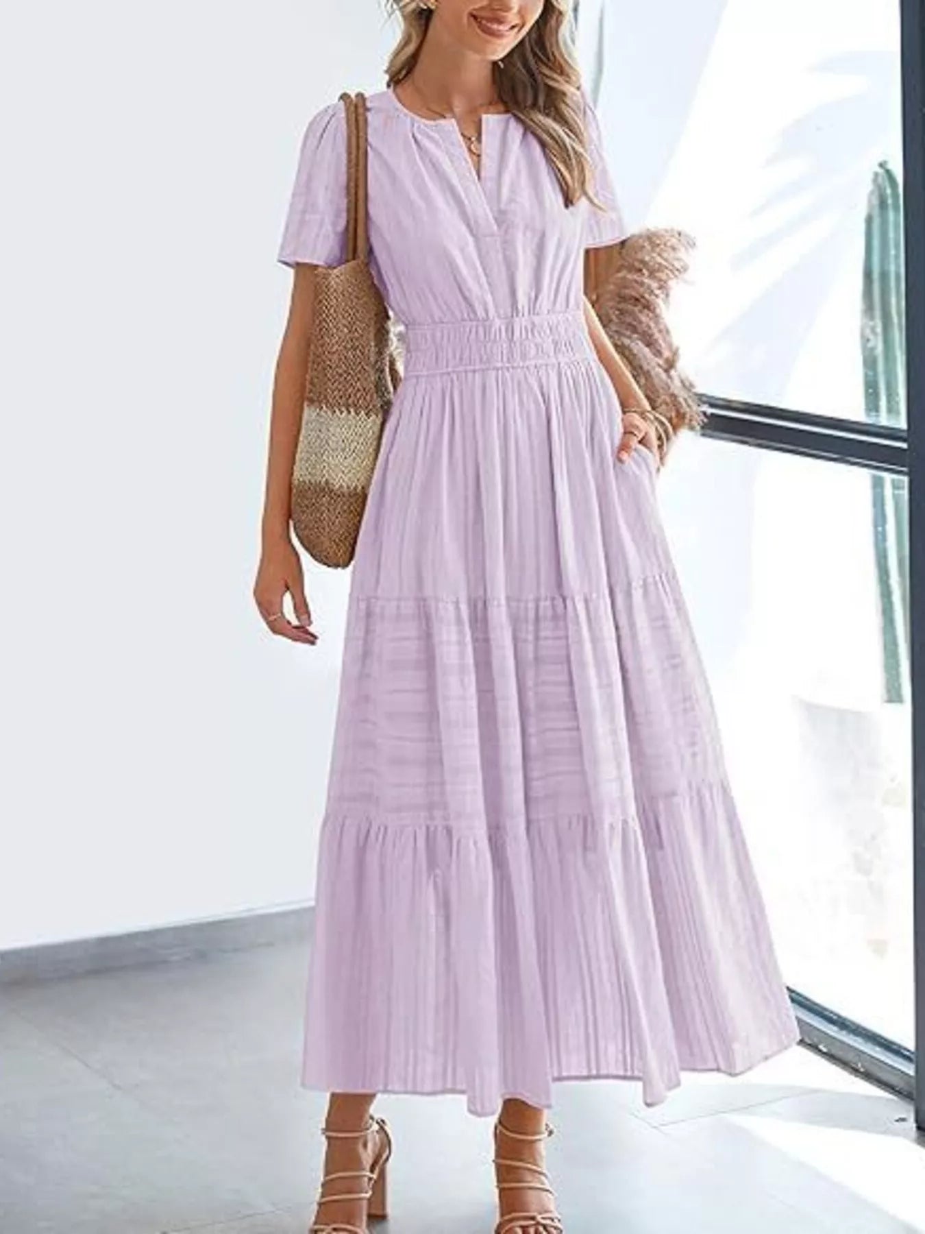 Tiered midi dress in mauve, short sleeves, V-neck, gathered smocked waist, tiered skirt.