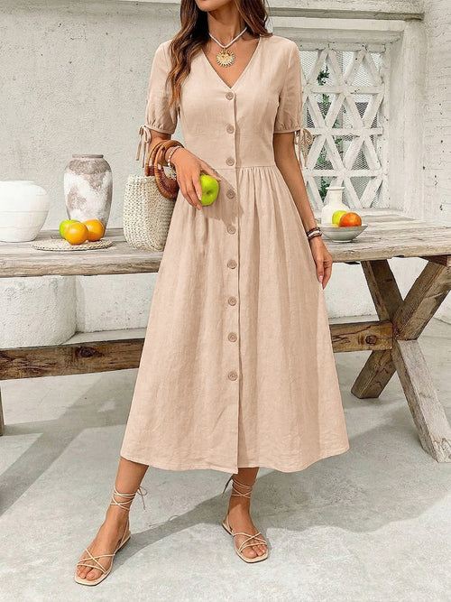Tan button-down midi dress with short sleeves, V-neck, and front button placket