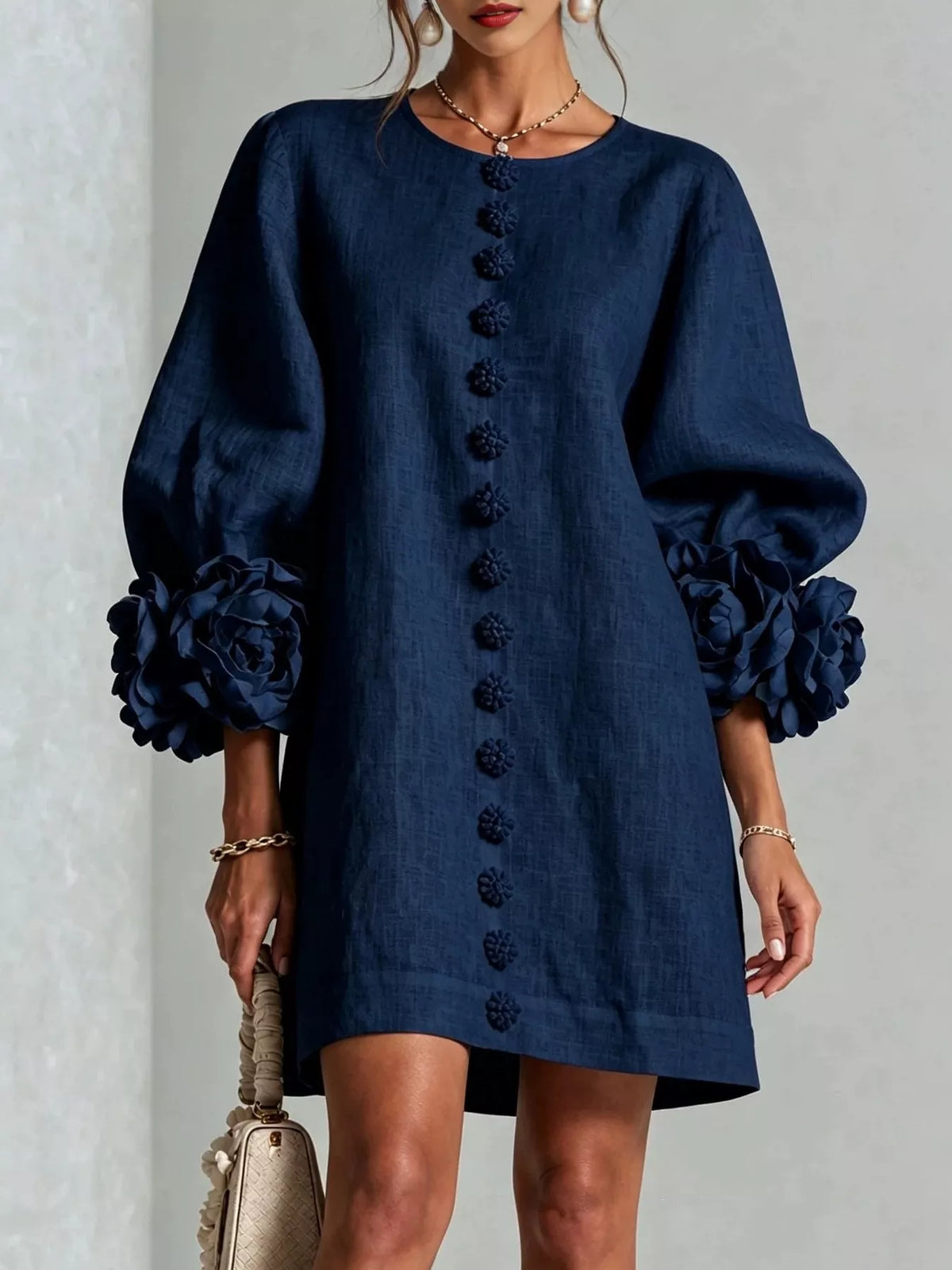 Navy polyester dress with round neck, long sleeves, and 3D floral button trim