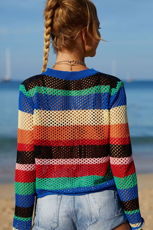 Back view of rainbow striped openwork knit cover-up with long sleeves and blue neck trim