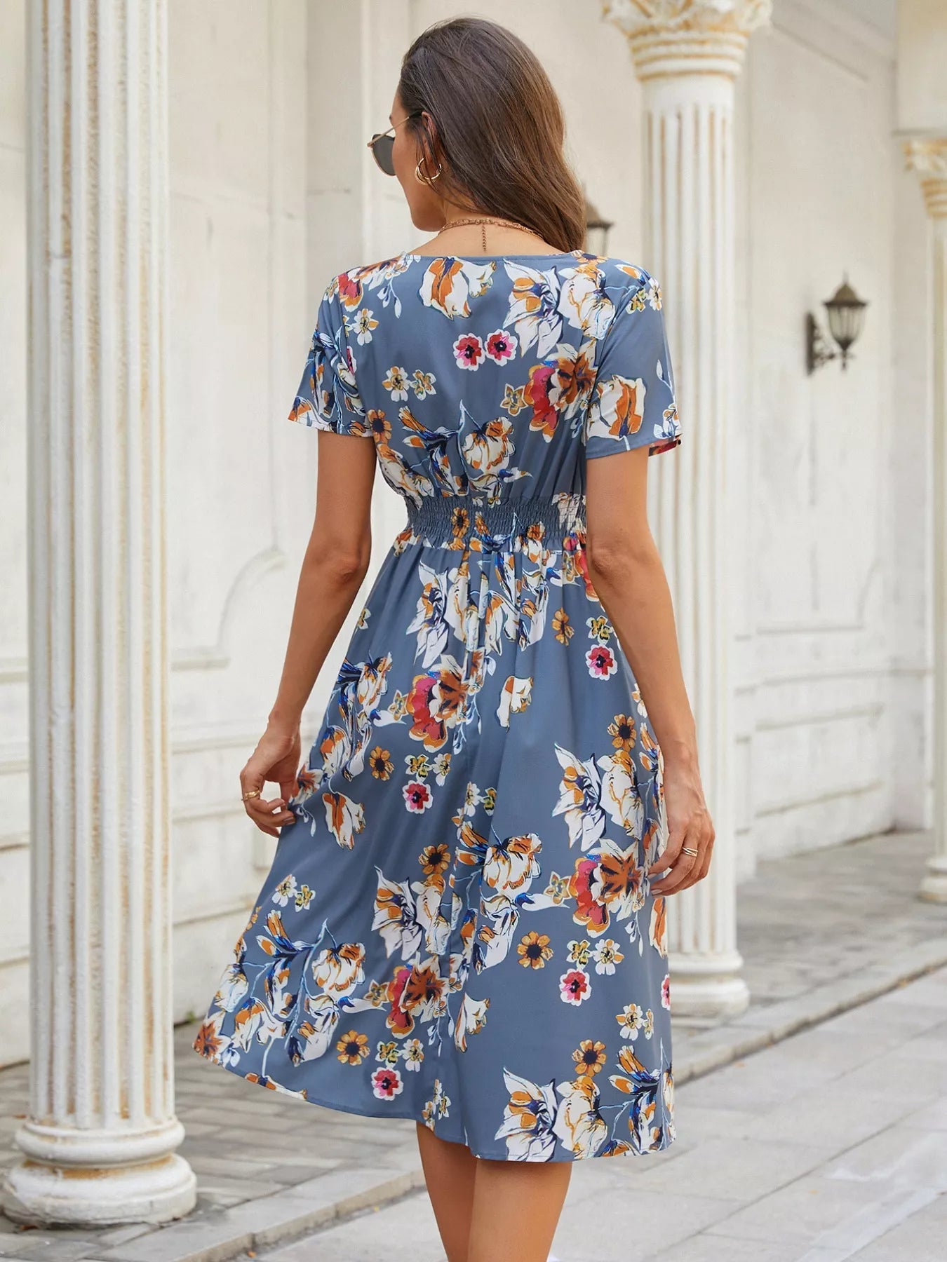 Printed short sleeve midi dress in light blue with orange and red flower print.