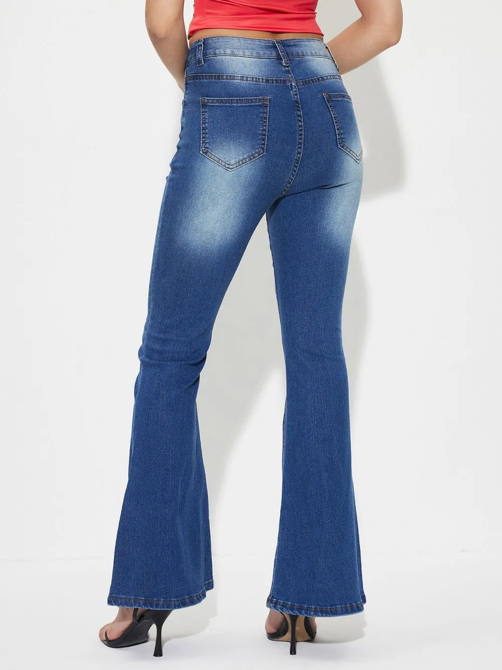 Mid-rise bootcut jeans, medium blue wash, back yoke and stitched back pockets