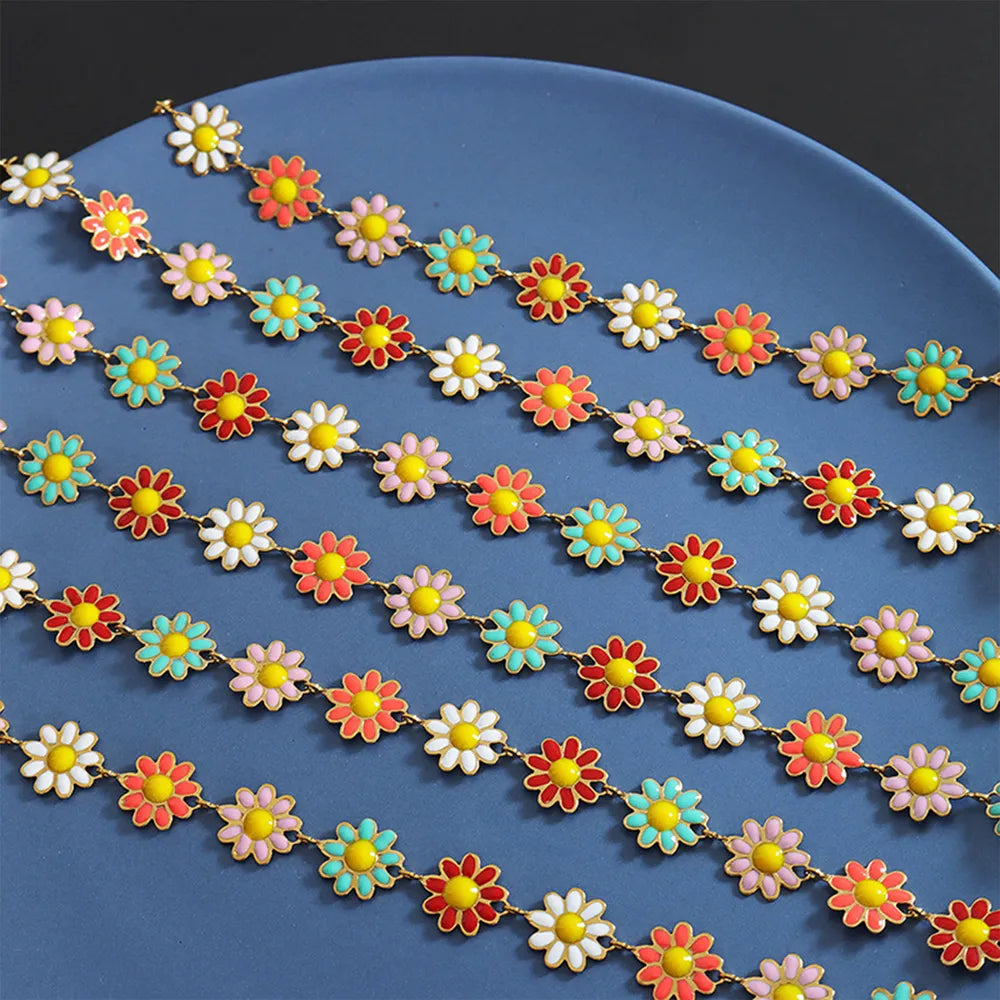 Gold-tone flower necklace, multicolor daisy links, close view