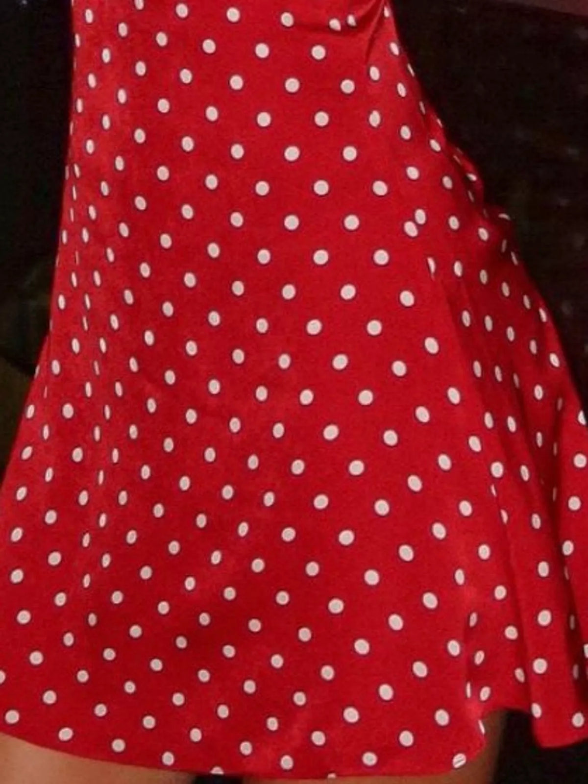 Red polka-dot bodycon mini dress with halter neckline and flared hem