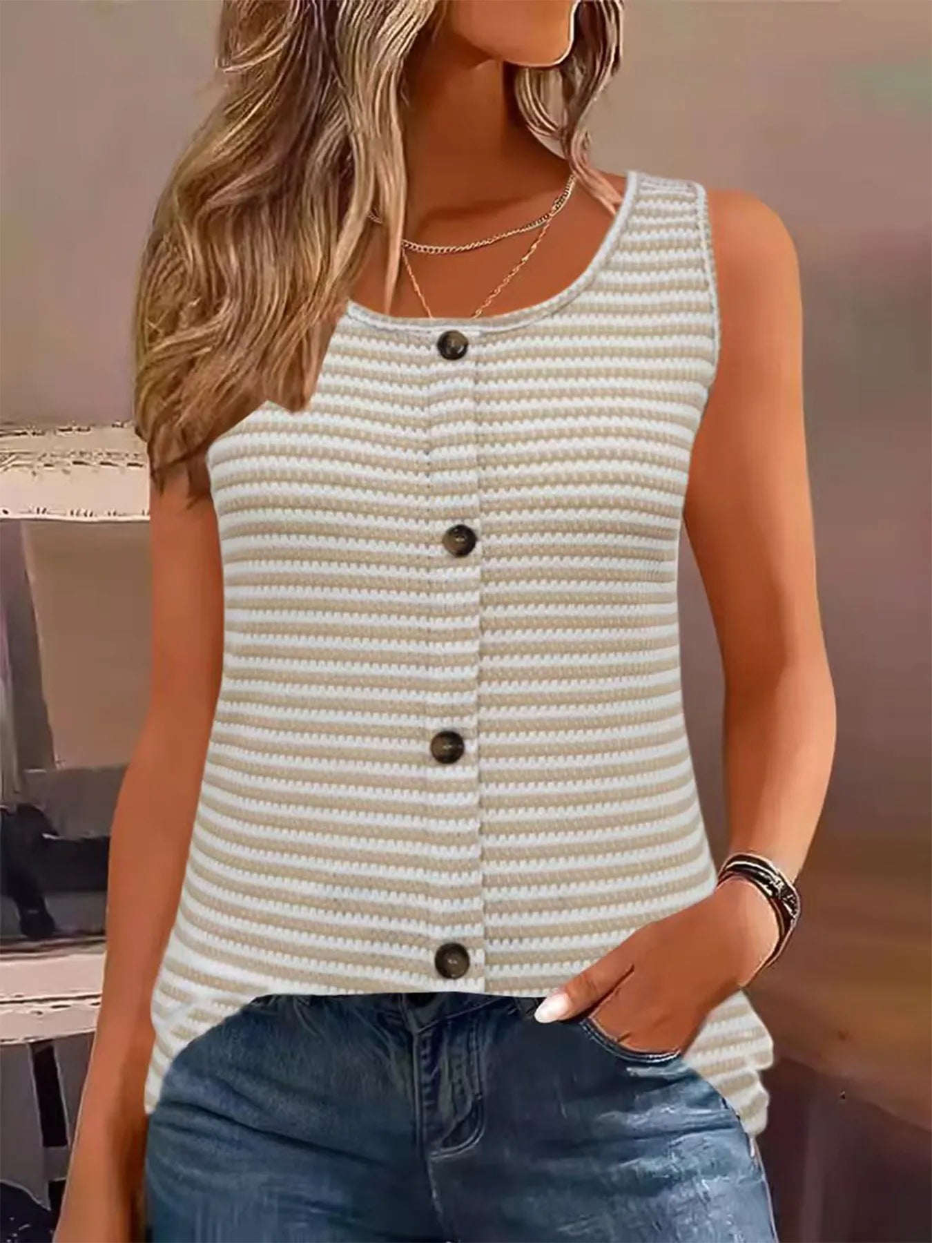 Striped knit button-front tank top in light cream with sleeveless V-neck and dark buttons