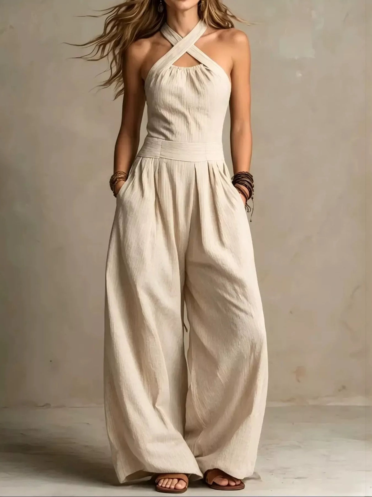 Off-white linen halter wide-leg jumpsuit with crisscross neckline and gathered waist