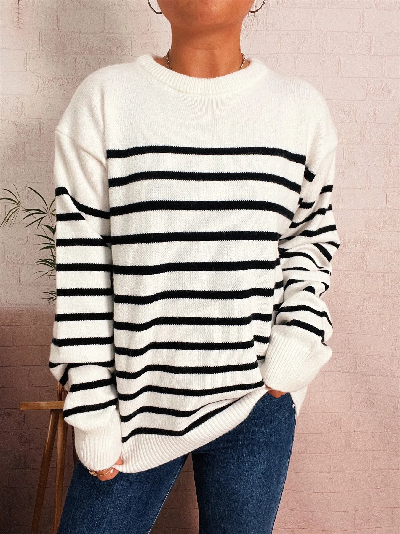 White striped round-neck drop-shoulder sweater, black horizontal stripes, ribbed cuffs