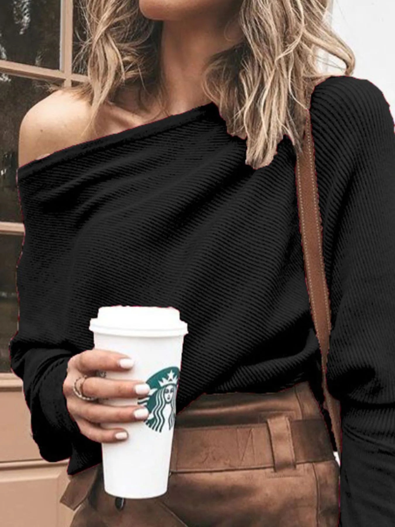 Black ribbed one-shoulder sweater top with long sleeves and textured knit