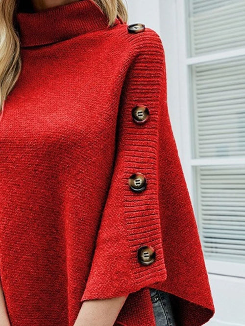 Red turtleneck poncho pullover with three-button detail along one shoulder