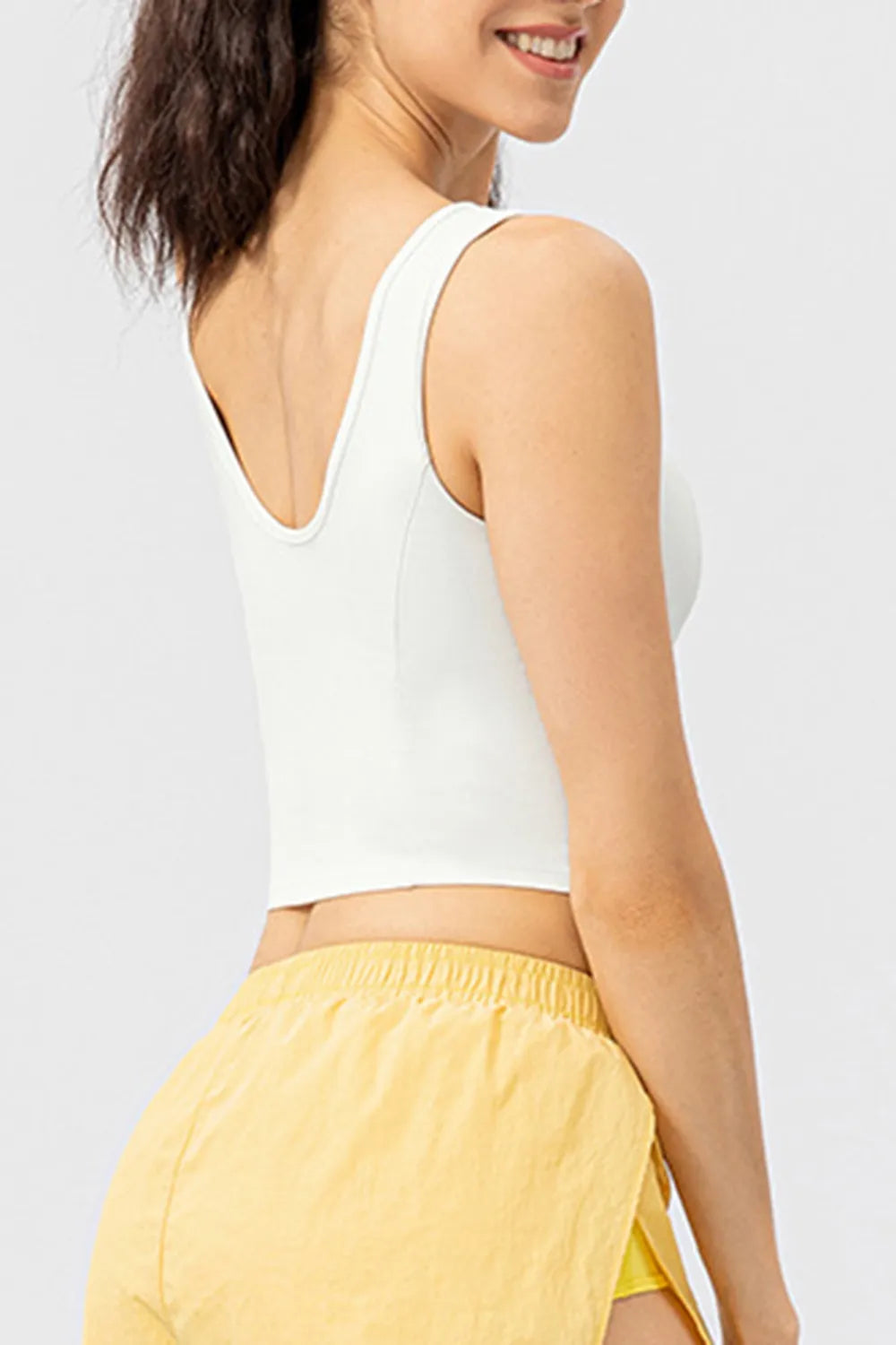White active tank top with wide straps and V-shaped back neckline