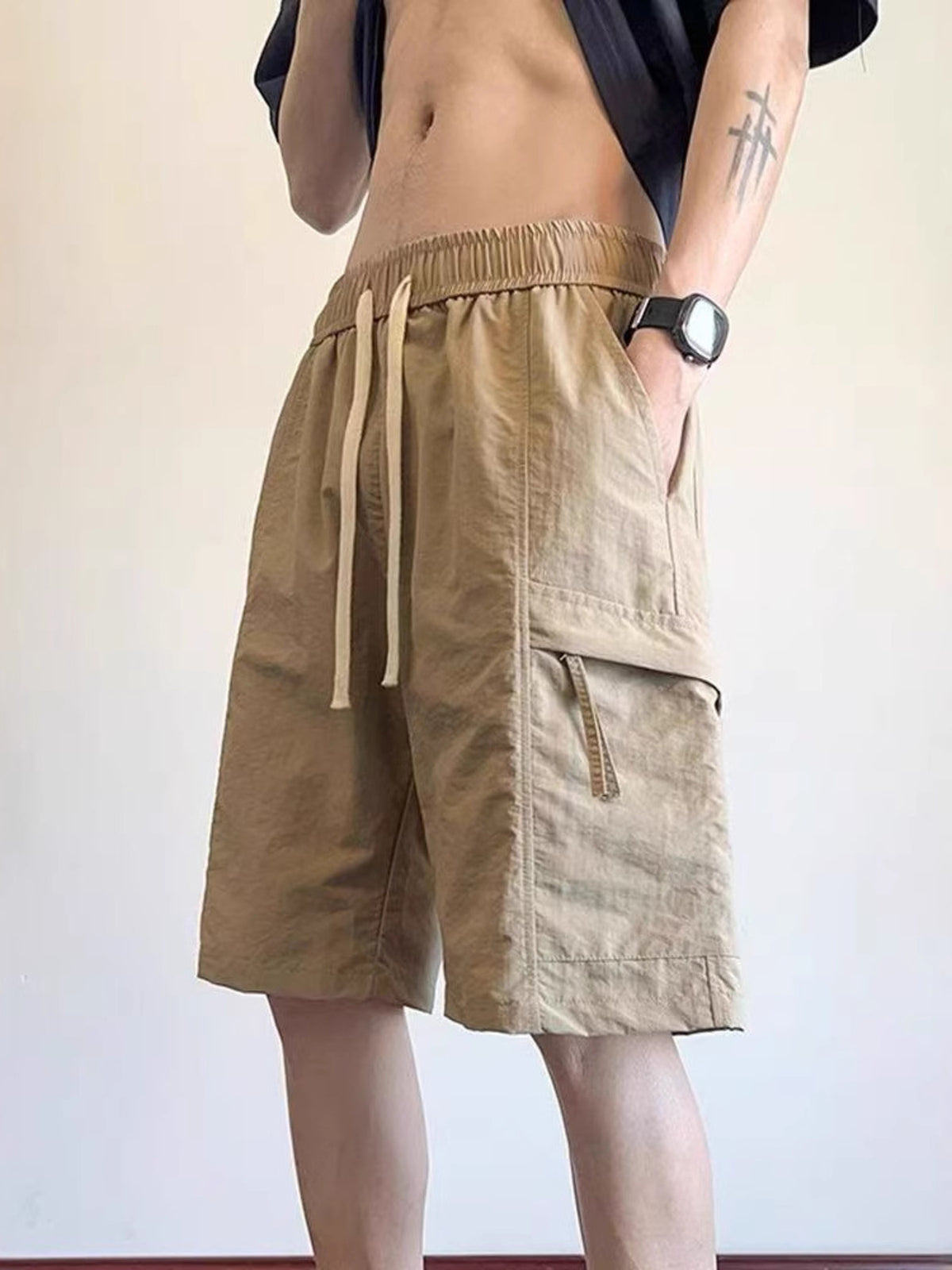 Lightweight khaki drawstring cargo shorts with elastic waistband and side cargo pockets