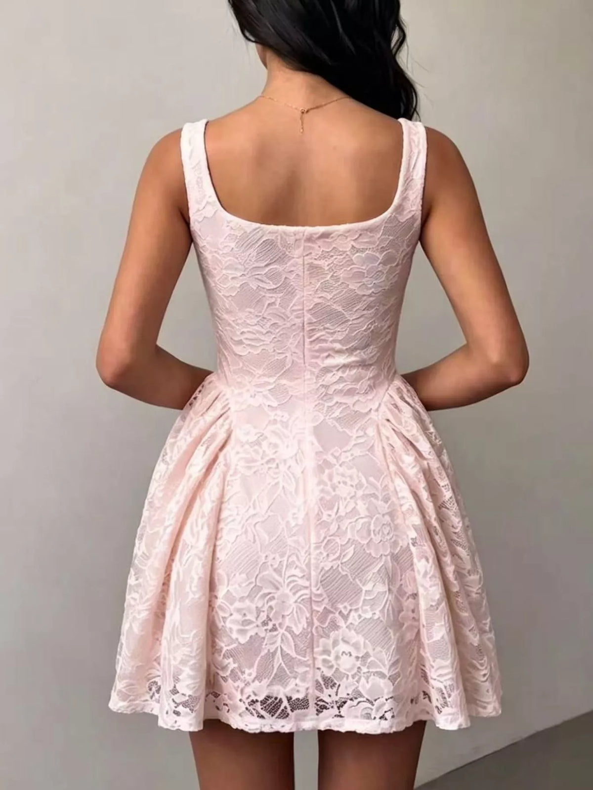 Pink lace square-neck sleeveless dress with open back and floral overlay