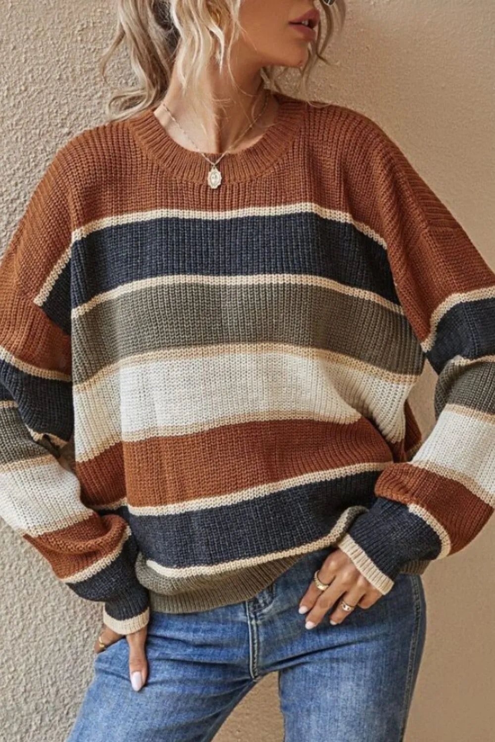 Striped round-neck long-sleeve sweater with brown, navy, cream, and tan horizontal bands