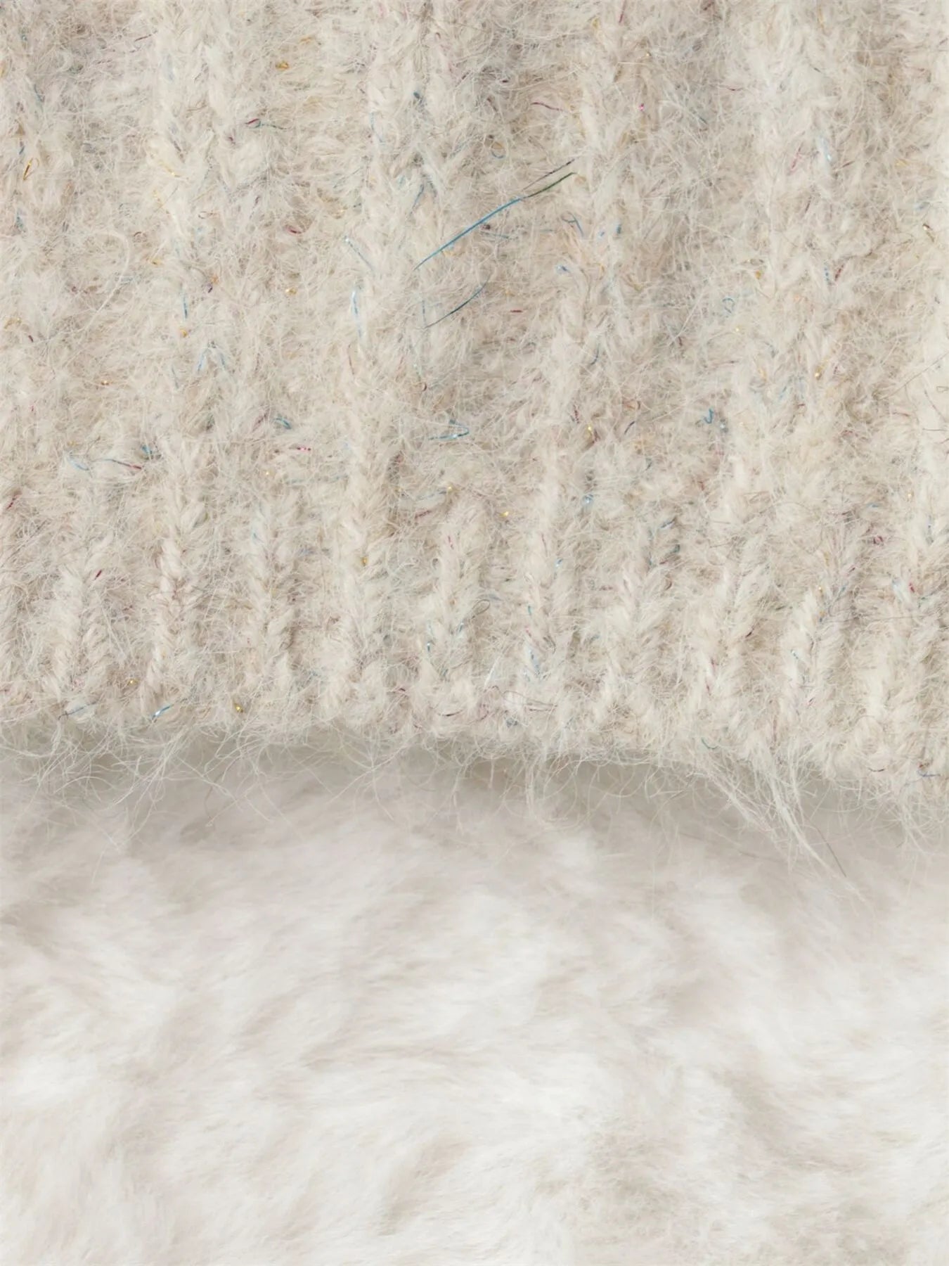 Cream cable-knit cardigan with ribbed trim and open button placket detail