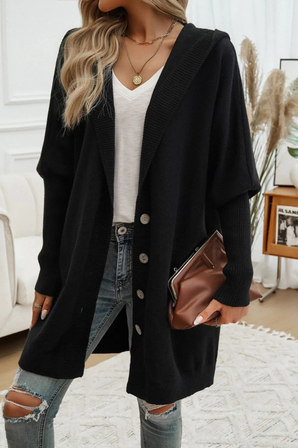 Black hooded long-sleeve button cardigan with deep V front and gold buttons.