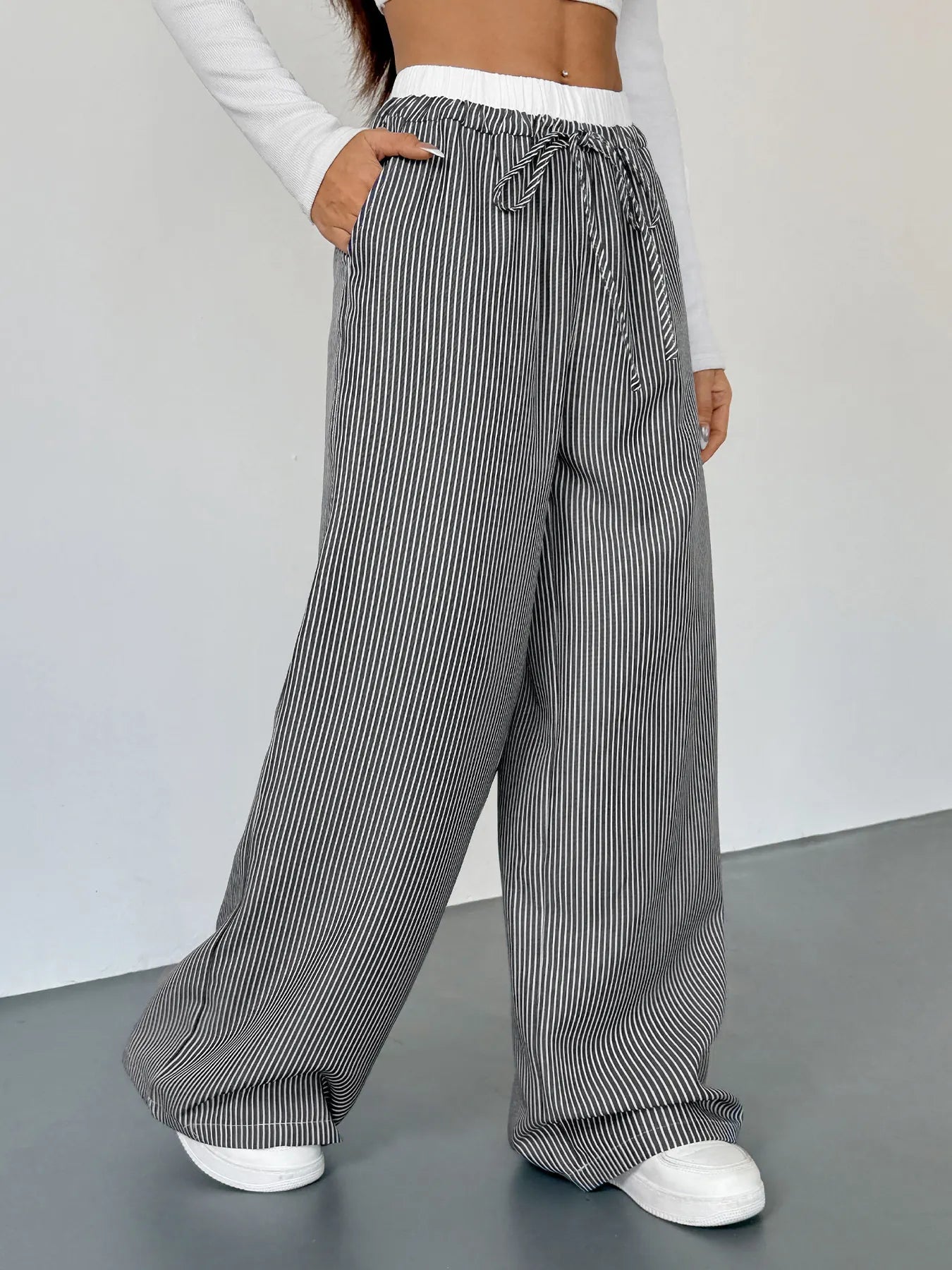 Striped wide-leg pants with drawstring waist, black-and-white vertical stripe pattern