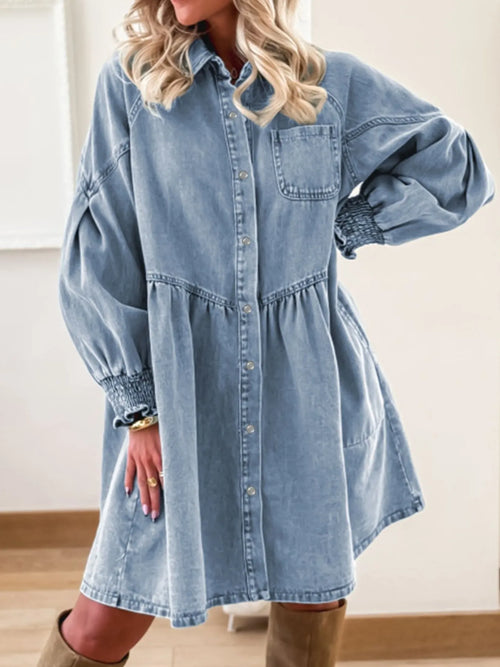Light blue denim shirt dress with button front and yoke seams, long puff sleeves