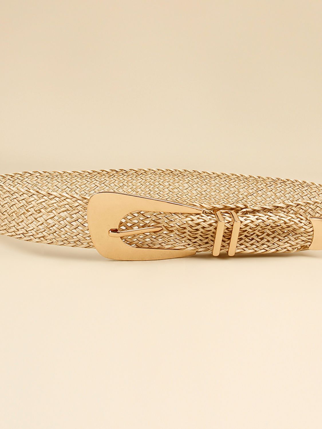 Woven braid belt strap with gold-tone irregular buckle, flat close-up detail