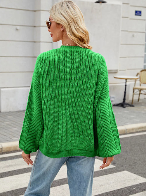 Green button-up long-sleeve cardigan from the back, featuring a ribbed knit design.