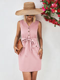 Blush pink sleeveless V-neck button dress with tied waist belt and flap pockets
