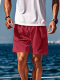Men's red casual drawstring shorts with side pockets, mid-length hem