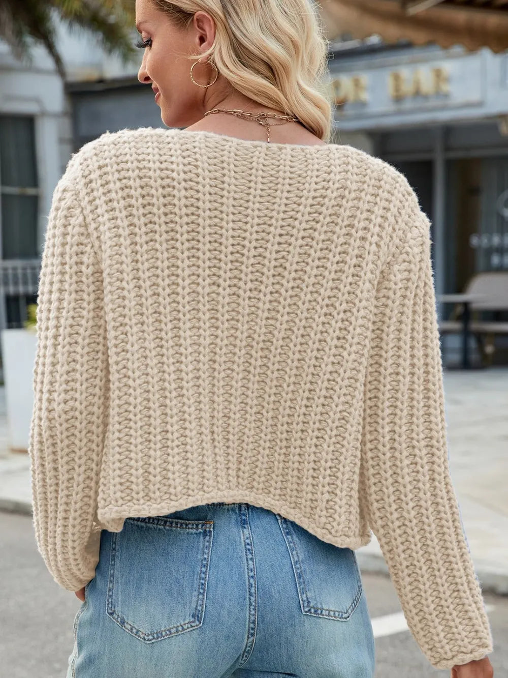 Cream chunky-knit button cardigan, back view with long sleeves