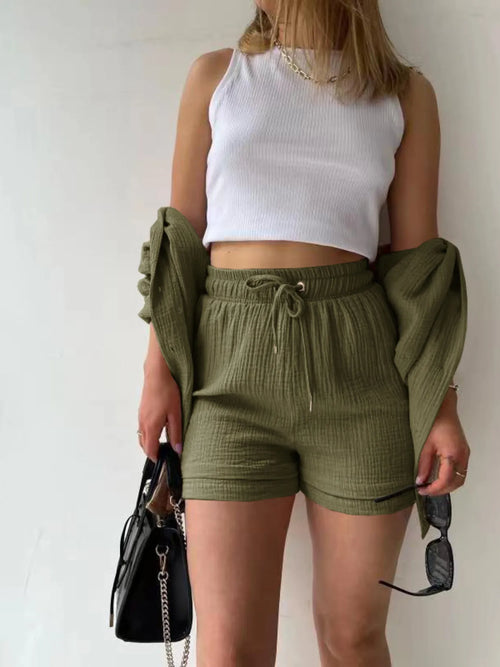 Olive green button-up shirt with shorts, long sleeves and drawstring waist, front buttons