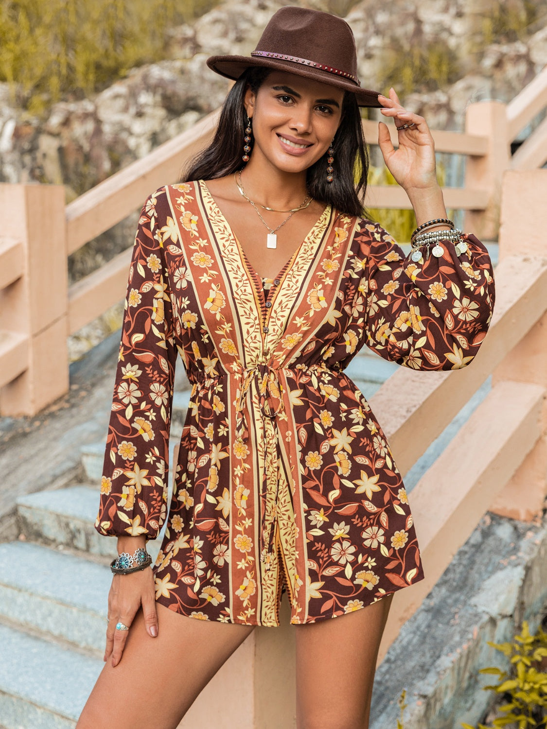 Cedar & Moore V-Neck Long Sleeve Romper in brown floral print with tie waist