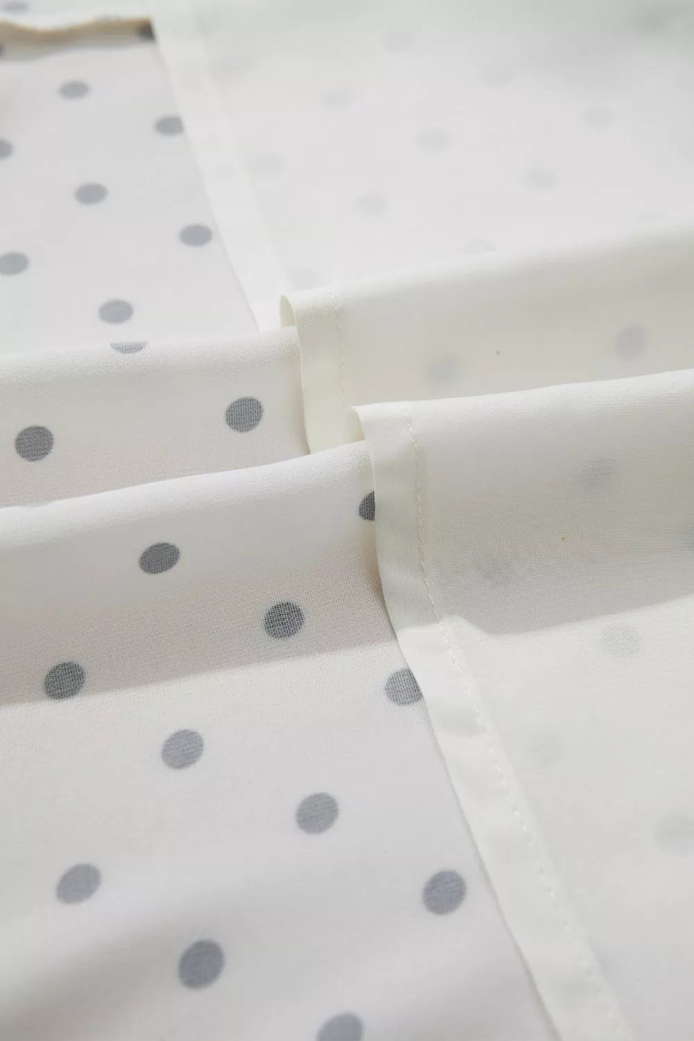 Cedar & Moore Polka Dot Half Sleeve Midi Dress by Trendsi, white fabric with gray dots, belted and buttoned