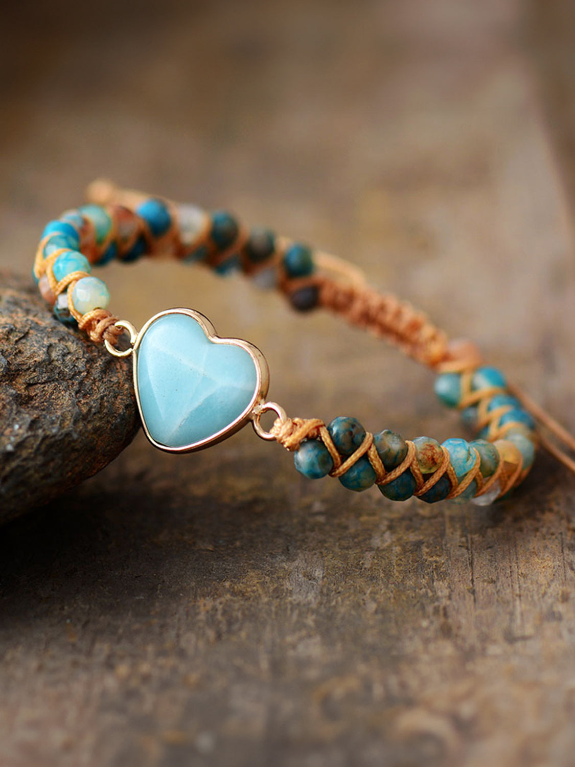 Heart beaded bracelet with light blue heart charm and turquoise, teal, and orange beads
