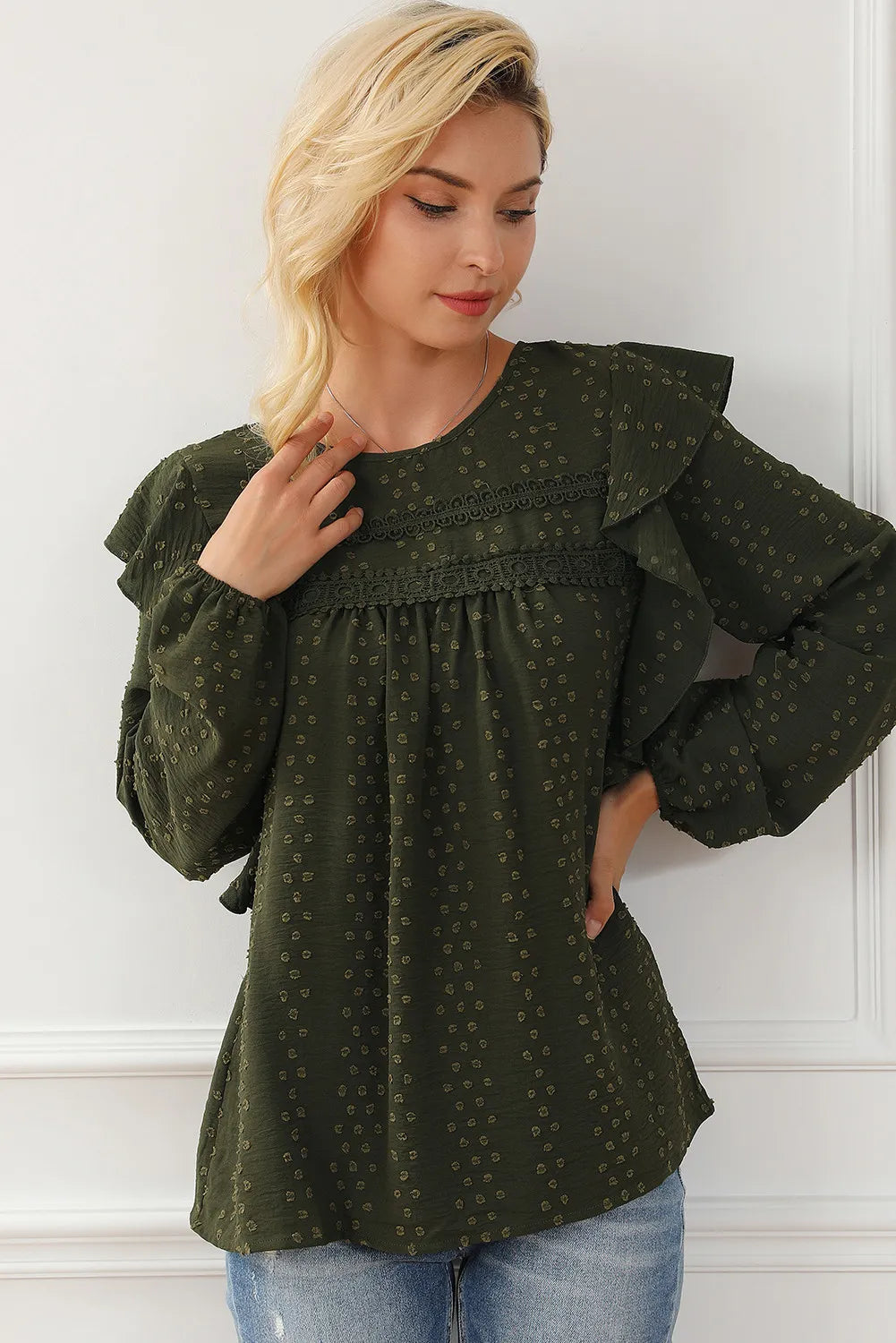 Ruffled round-neck blouse in dark olive green with long sleeves and allover tiny dots