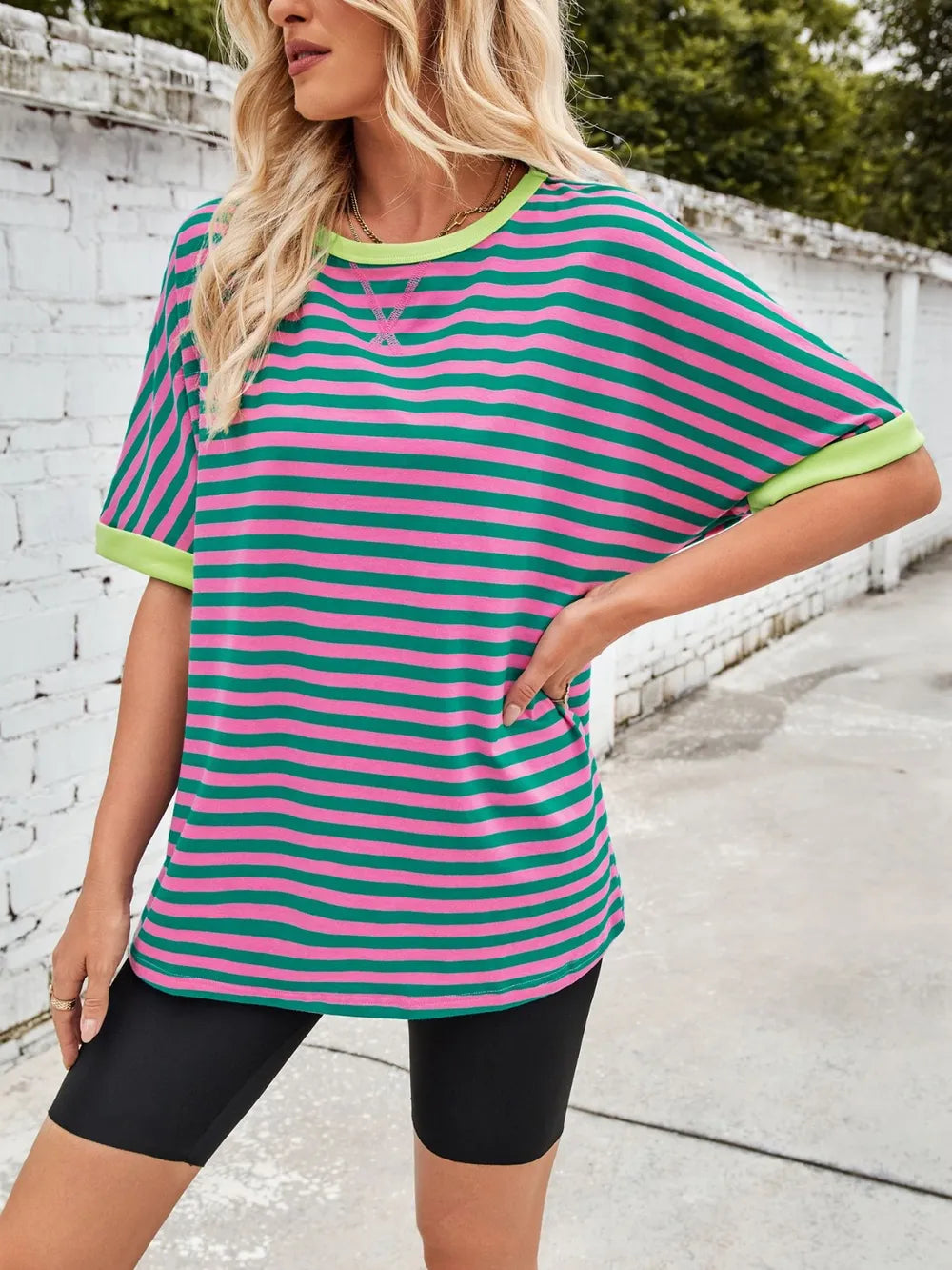 Striped round-neck half-sleeve T-shirt in green with pink horizontal stripes