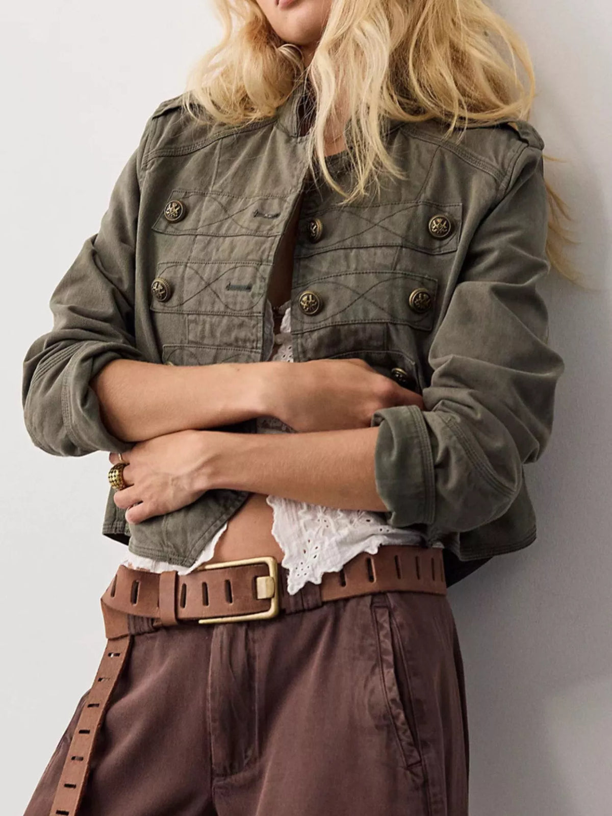 Olive cropped cotton button jacket with flap pockets and button details.