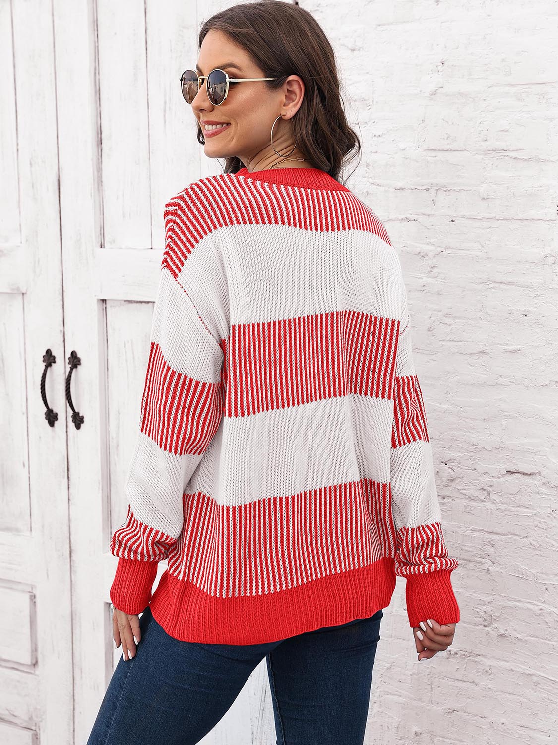 Striped knit sweater back view with round neck, drop-shoulder long sleeves in red and white