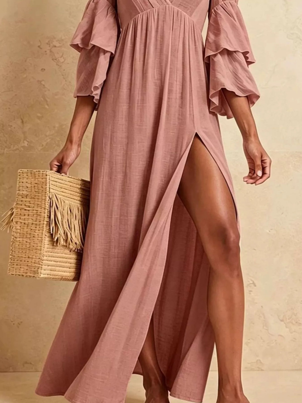 Dusty pink high-slit V-neck dress with flowing fabric and side opening
