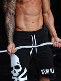 Men's skull drawstring shorts, black with white skull and GYM KIN print
