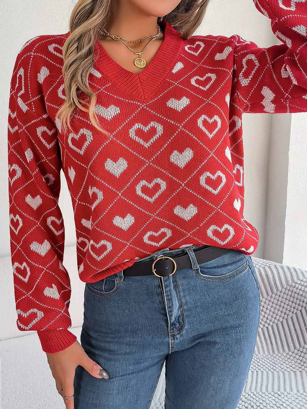 Deep red heart-pattern V-neck sweater with long sleeves and ribbed hem