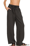 Black woven crepe elastic-waist pants with drawstring, relaxed straight legs