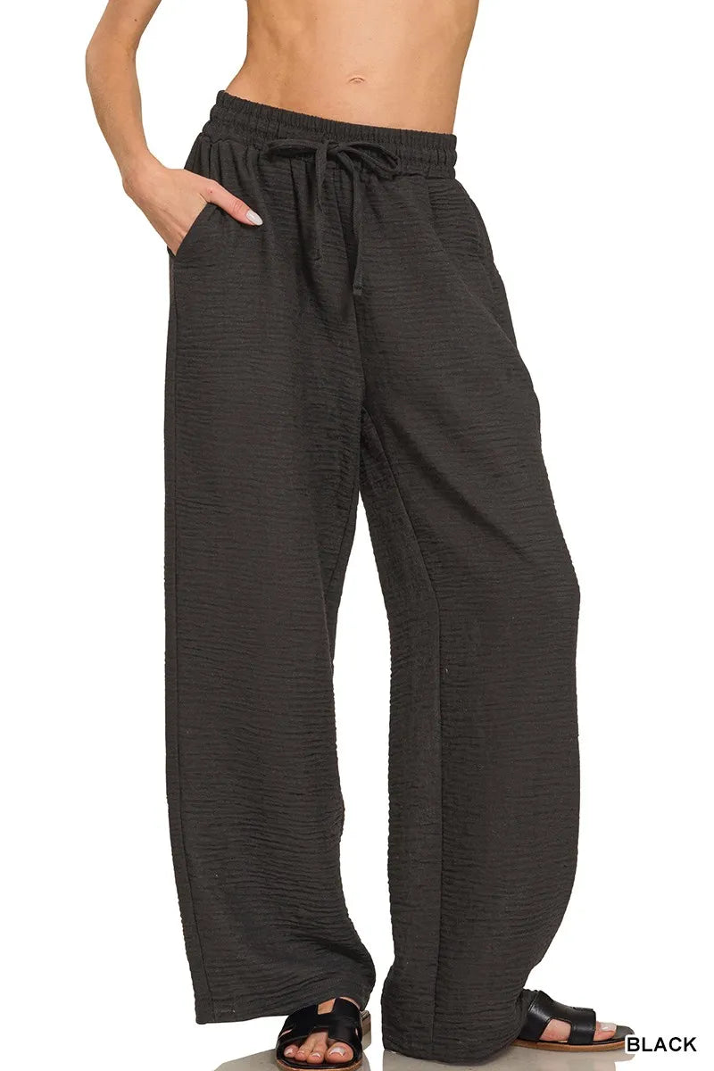 Black woven crepe elastic-waist pants with drawstring, relaxed straight legs