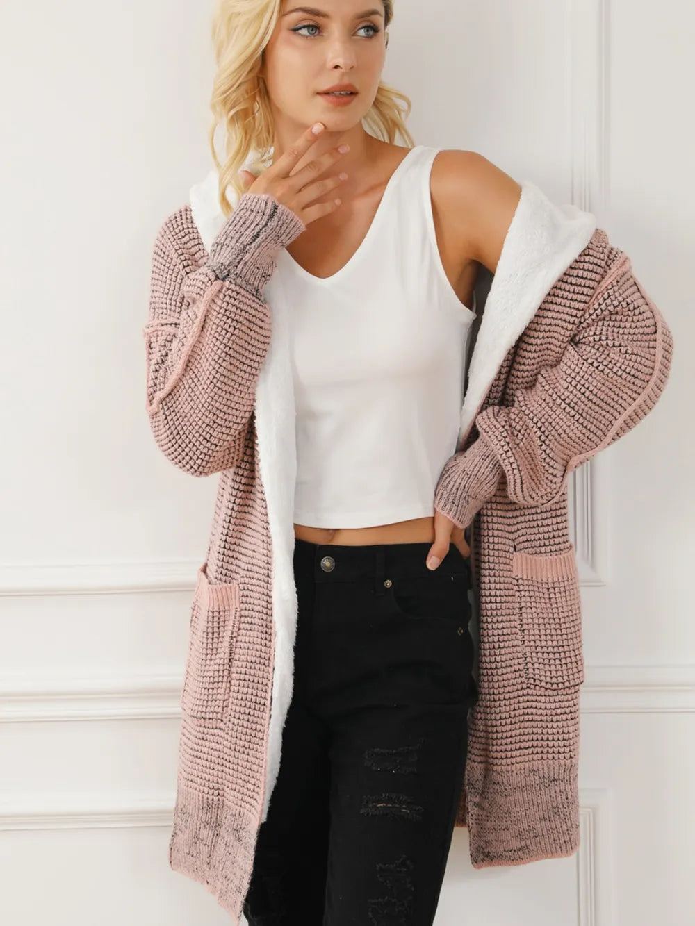 Open-front hooded winter coat with pockets, blush pink textured knit, hood and open front.