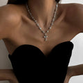 Silver cross pendant alloy necklace with dangling cross and small starburst charms