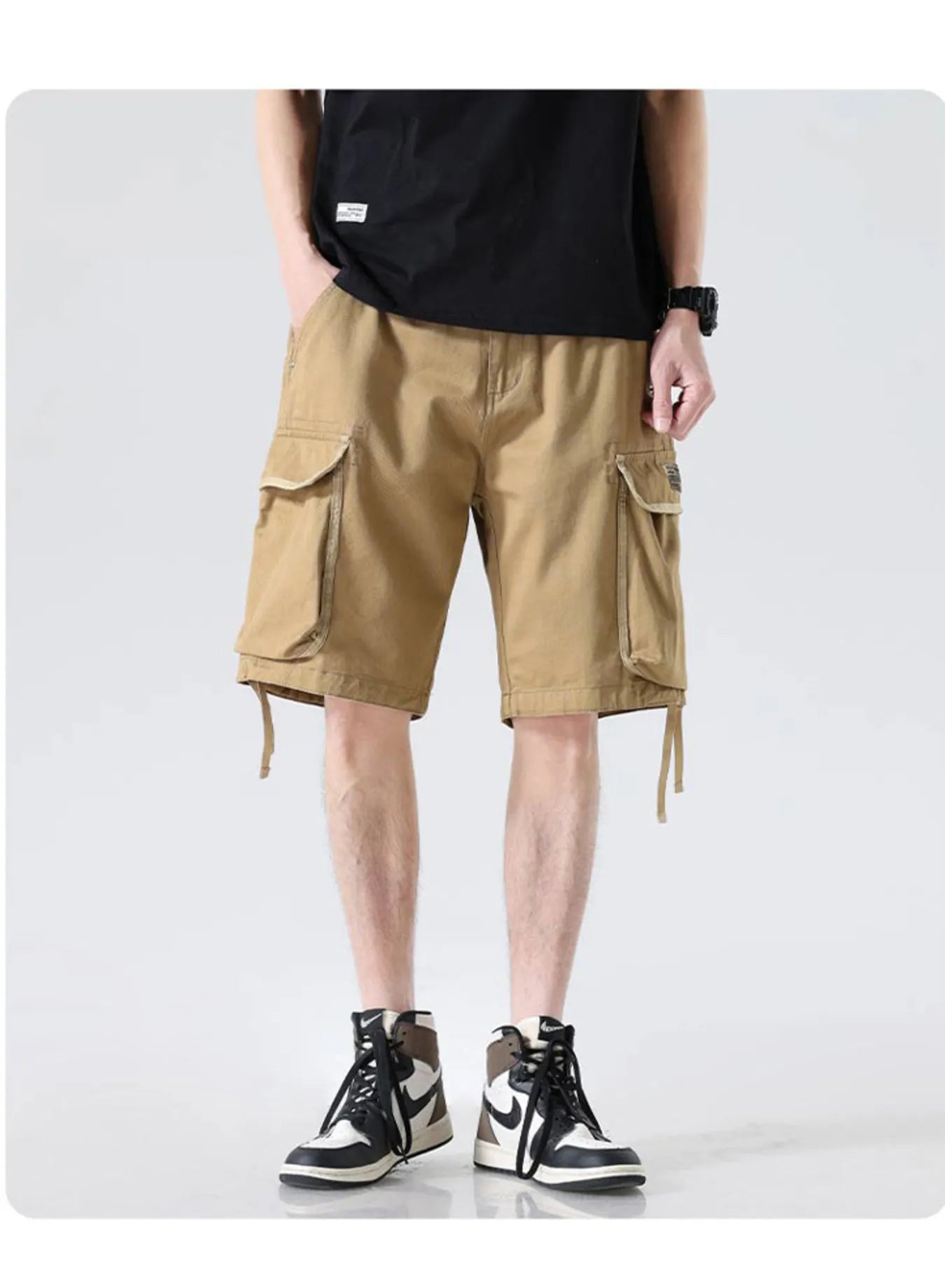 Men's khaki drawstring wide-leg cargo shorts with side cargo pockets and drawcord hems