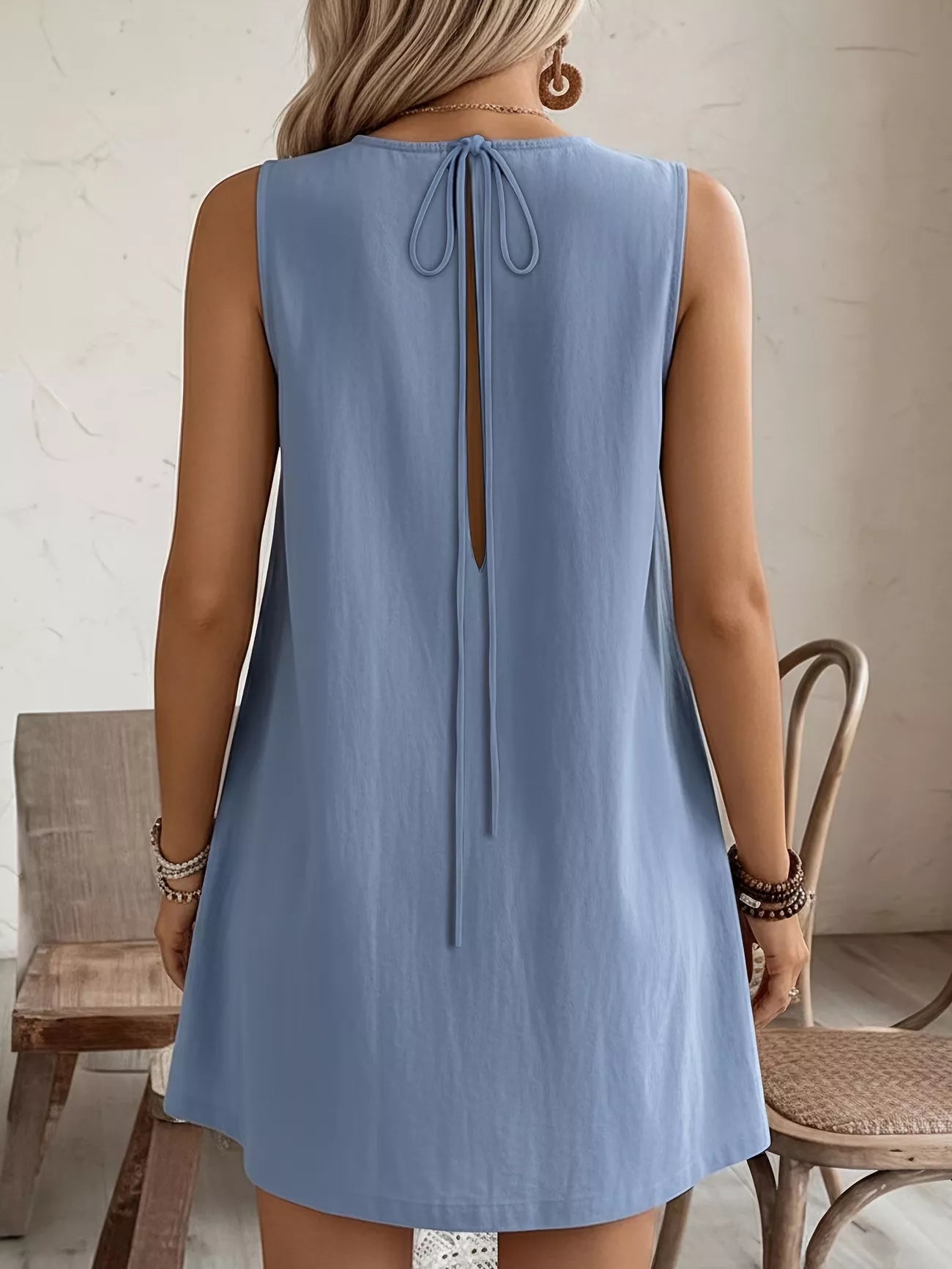 Cedar & Moore Frill Sleeveless Round Neck Dress in light blue with back tie and keyhole opening.