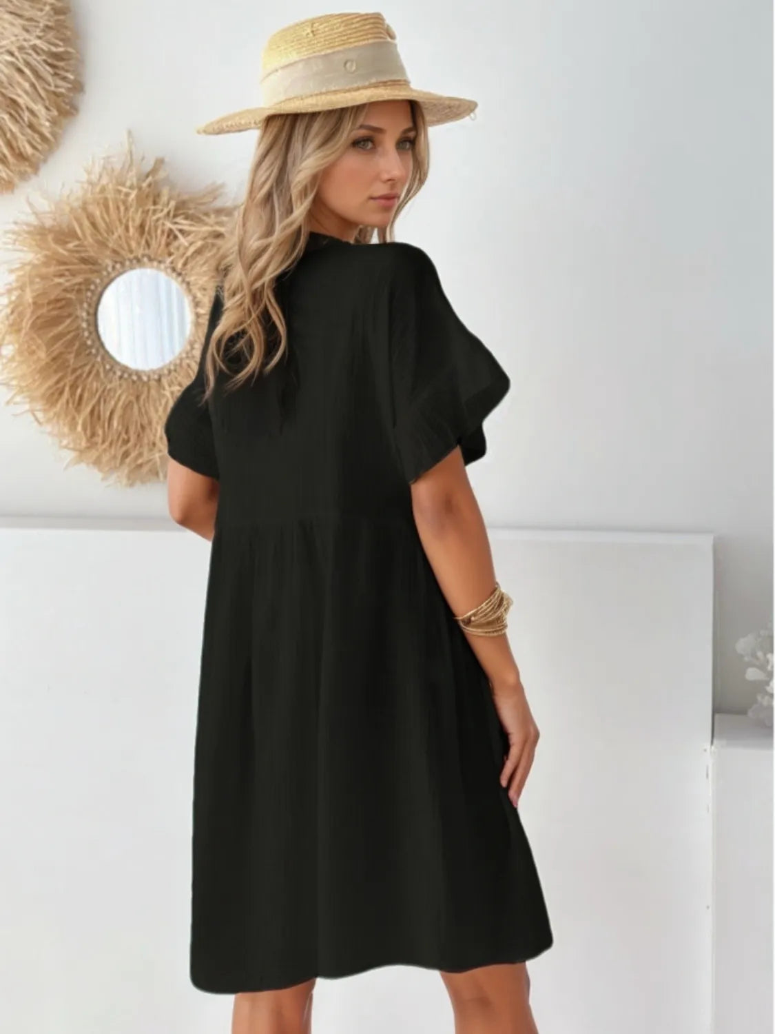 Round neck short sleeve mini dress in black by Trendsi, knee-length.