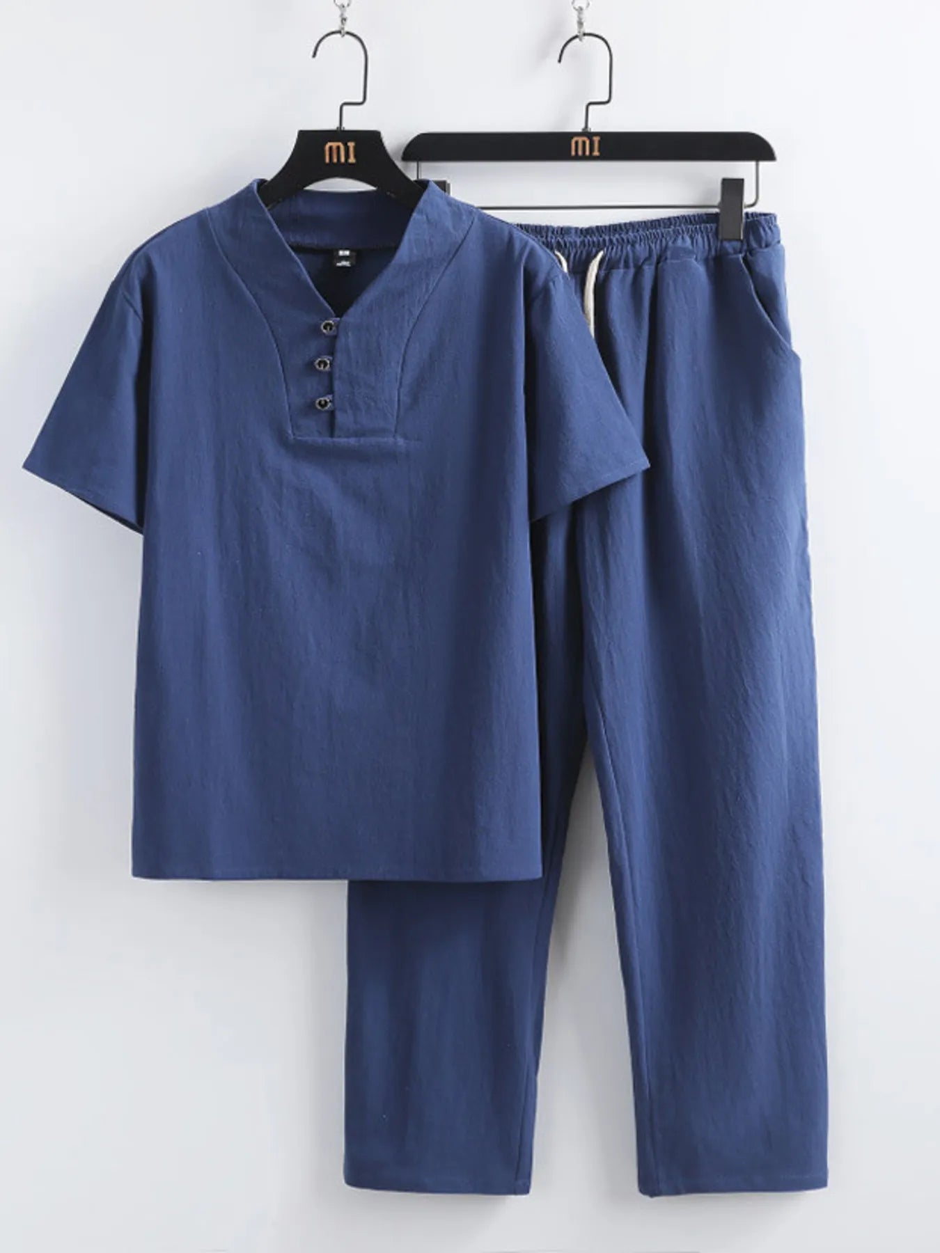 Navy blue V-neck short-sleeve top with button placket and matching elastic-waist pants