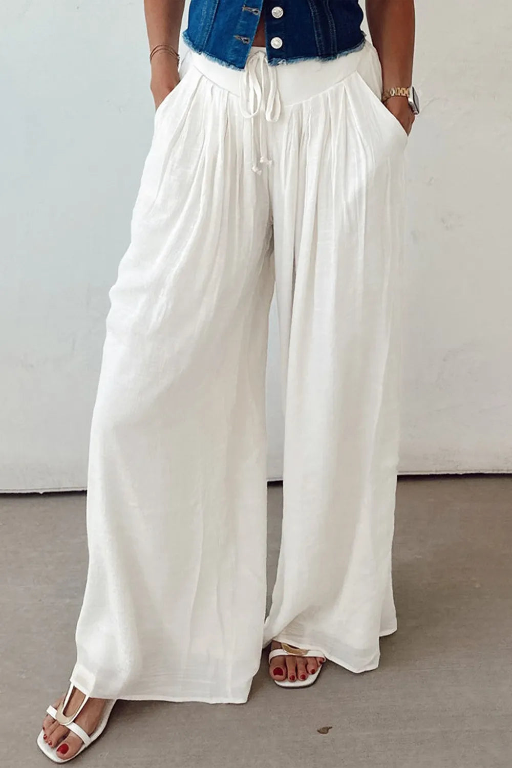 White wide-leg pants with drawstring waist and relaxed wide legs